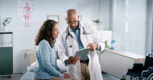 Doctor discussing cortisol test results with a woman.