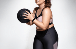 Strong woman workout with medicine ball.