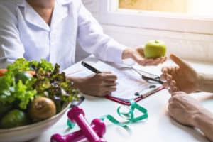 Nutritionist giving consultation to patient