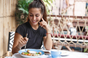 Woman enjoying good health after under care of functional nutritionist in NYC